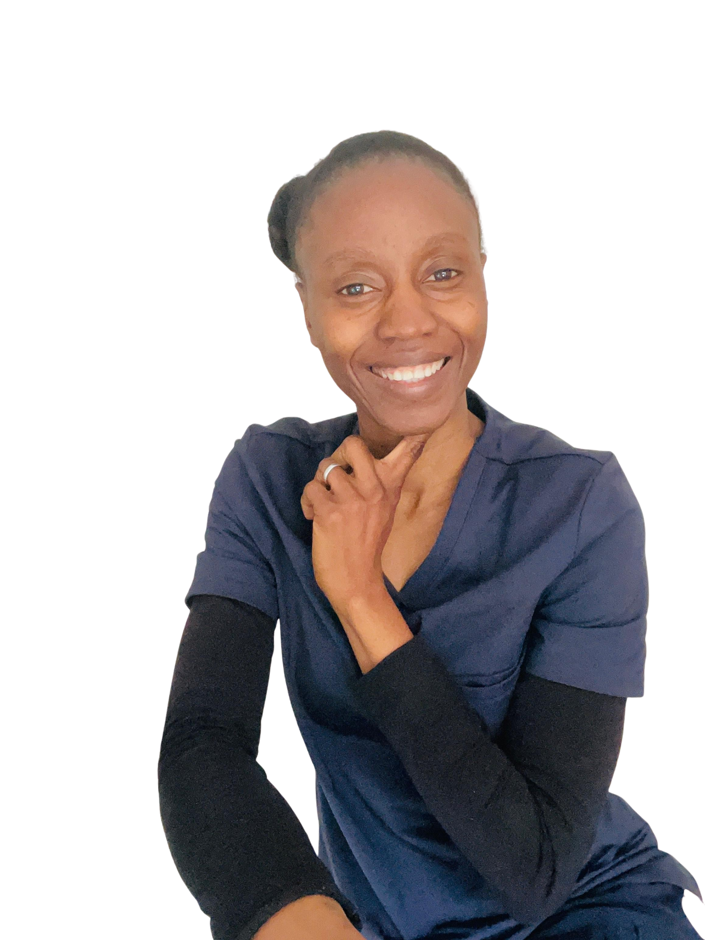 Faith Abdulsalam, health coach, smiling warmly outdoors